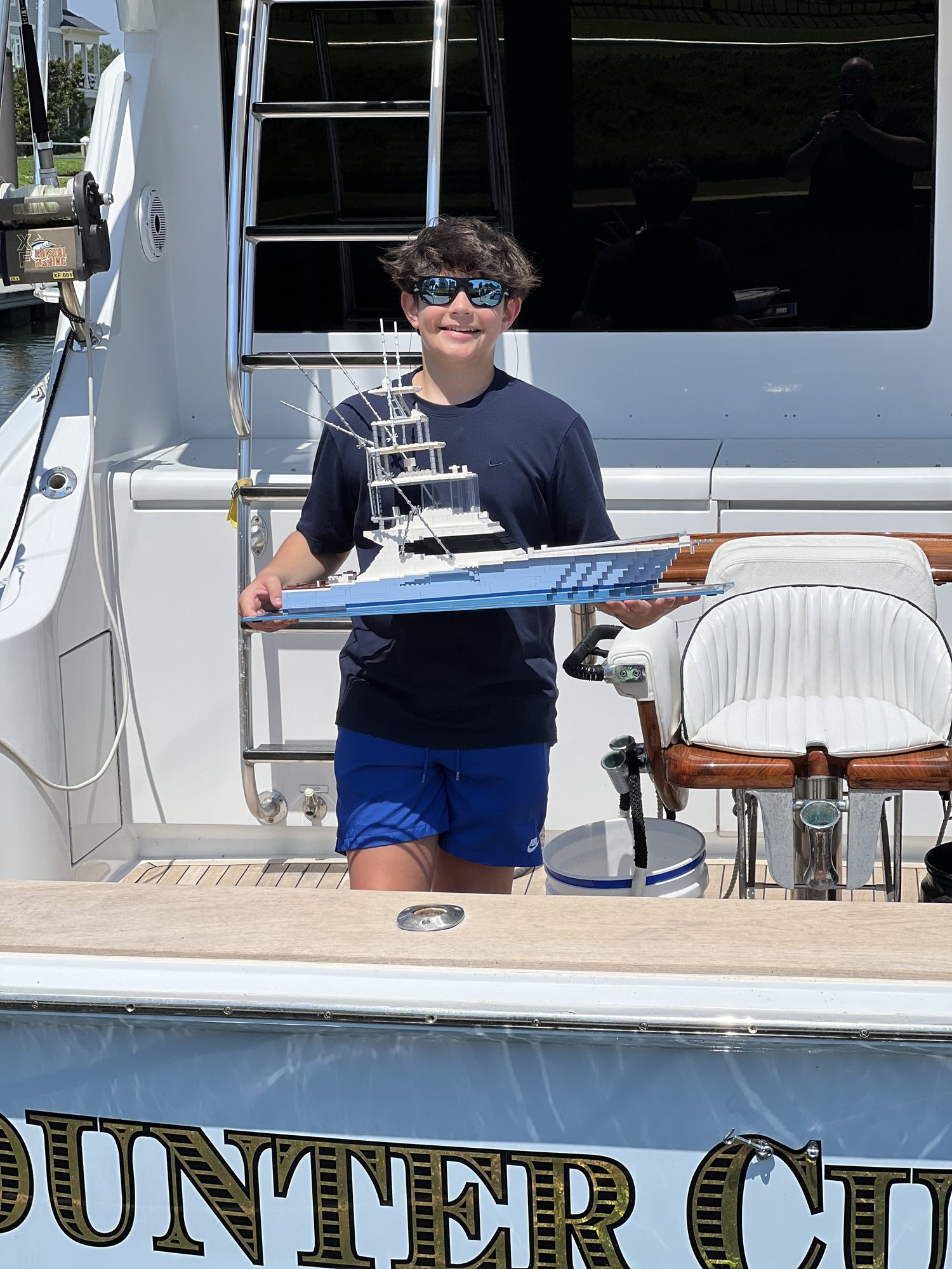 Brock, founder of BrickWake, holding one of his custom LEGO® sportfish models
